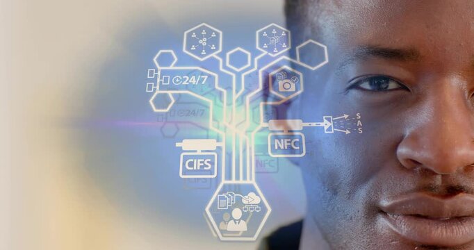 Tech pro standing by wall viewing floating hexagon icon visualizing data flow modules collapsing