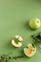 Still life of apple slices with mint and basil in a studio