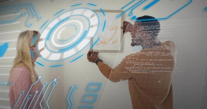 Home decorators aligning botanical print frame on wall mark as AR grid updating and testing hold