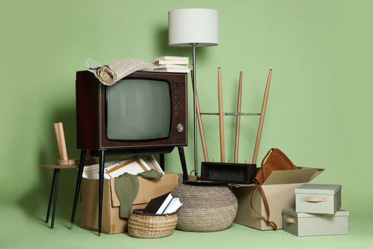 Garage sale. Different used stuff on green background