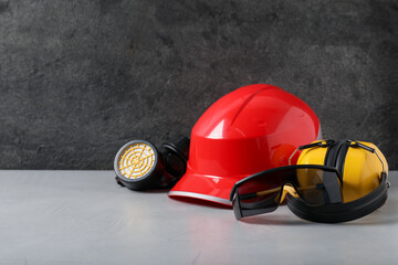 Different safety equipment on light table. Space for text