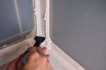 The process of applying sealant during a bathroom renovation involves multiple technical steps
