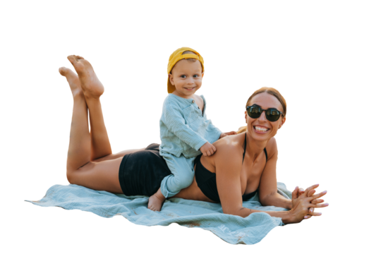 Cute caucasian young boy in casual sitting on moms back on transparent background. Cheerful young American woman in swimsuit laying on sand at seaside, playing with son wearing sunglasses. Vacations w