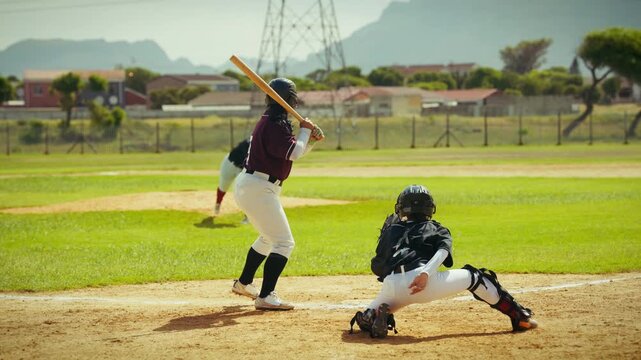 A baseball player connects with a pitch, drops her bat, and sprints towards first base. Displays athletic prowess and determination in the game.