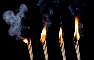 Set matchstick ignite burning bright fire flame isolated on black, clipping