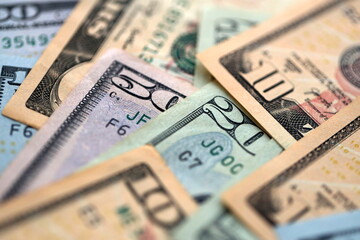 Big amount of different dollar bills close up. Hundred fifty twenty ten and five dollar banknotes