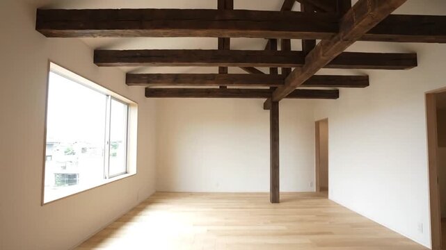 Elegant Interior A Spacious Empty Home Showcasing Exposed Beams and Natural Light