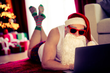 Fun Santa-themed image with a modern twist featuring festive decor