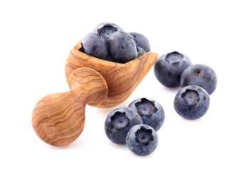 Blueberries Isolated on White Background.  Ripe berries in thr wooden spoon.
