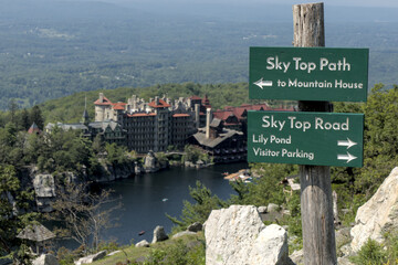 sky top path sign in mohonk preserve with view of lake hiking trail mountain hotel house hike marker path arrow shawangunk mountains ridge gunks new paltz skytop road lily pond valley parking