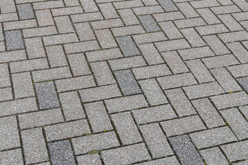 Gray cobblestone texture in perspective. Gray background with cobblestone pattern