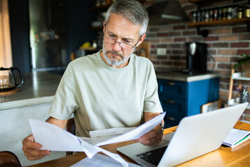 Mature man working from home office