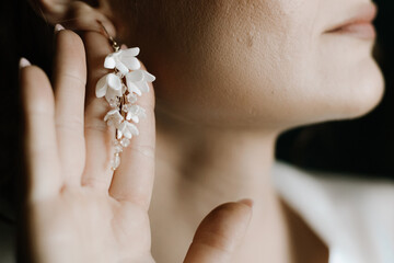 Woman putting on luxury jewelry, elegant accessories and fashion concept, stylish adornment for...