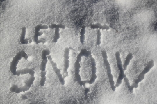 Let it snow sign in the snow