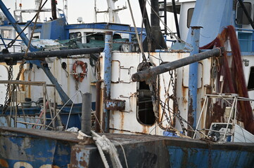 Rusty Fishing Boat with Lifebuoy and Broken Structures