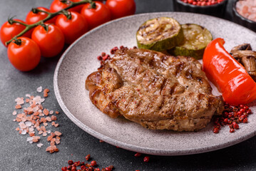 Grilled beef or pork steak, healthy restaurant food for lunch. Barbecue steak as a background
