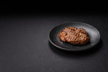Grilled beef or pork steak, healthy restaurant food for lunch. Barbecue steak as a background