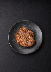 Grilled beef or pork steak, healthy restaurant food for lunch. Barbecue steak as a background