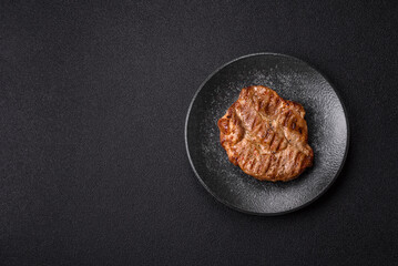 Grilled beef or pork steak, healthy restaurant food for lunch. Barbecue steak as a background