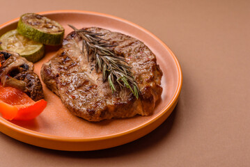 Grilled beef or pork steak, healthy restaurant food for lunch. Barbecue steak as a background
