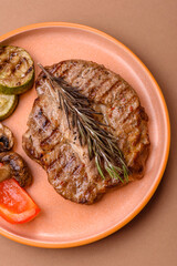 Grilled beef or pork steak, healthy restaurant food for lunch. Barbecue steak as a background