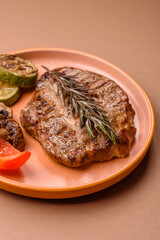 Grilled beef or pork steak, healthy restaurant food for lunch. Barbecue steak as a background