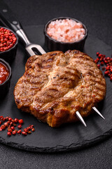 Grilled beef or pork steak, healthy restaurant food for lunch. Barbecue steak as a background