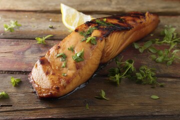 Close-up of grilled salmon fillet with crispy golden skin