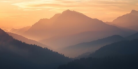 Sunrise over misty mountain peaks with soft pastel light and calm sky
