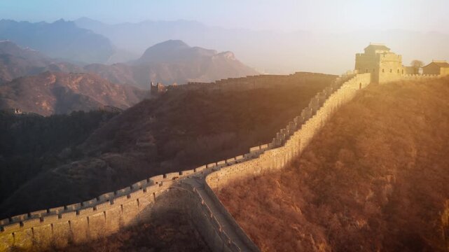 Aerial shot of the Great Wall of China at sunrise.