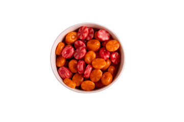 Top view of a white bowl filled with vibrant red and orange hard candies on a transparent background. Perfect for themes related to food, sweets, and celebrations.