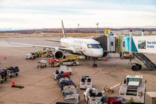 Air Canada plane at Calgary International Airport being prepared for takeoff. Air Canada is the flag carrier and the largest airline of Canada.