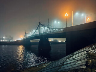 A bridge over a river with lights on it
