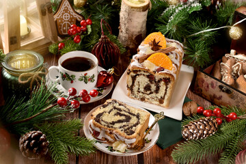 Homemade poppy seed cake and coffee on Christmas table