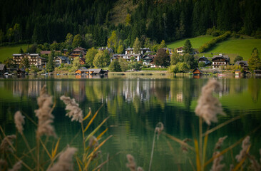 Fototapeta premium Weissensee, Austria: autumn landscape with lake in Neussach village