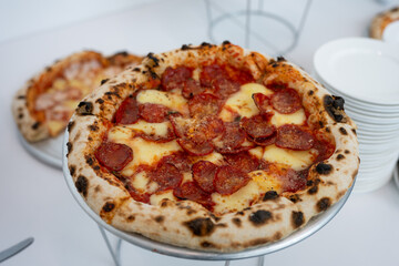 Assortment of Freshly Baked Pizzas at a Buffet