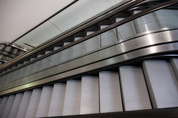 Obraz premium Modern Escalators and Elevators in a Contemporary Building Interior