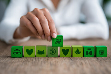 Employee perks visual with hand arranging green blocks for insurance, pension, paid time off, and financial support in casual work environment 
