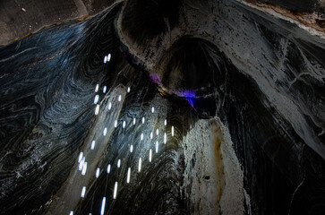 Abstract View of Layered Salt Mine Walls Illuminated by Modern Vertical Lights