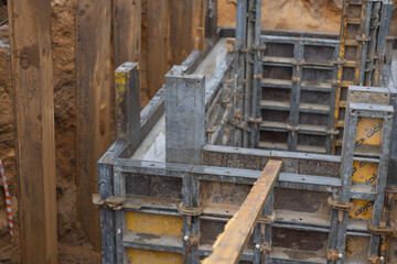 Construction site with concrete formwork in a trench