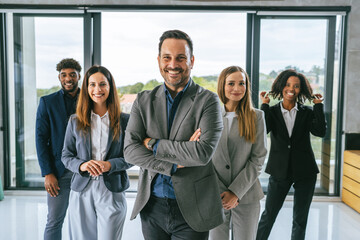 Obraz premium Diverse business team smiling standing in office