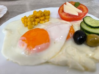 morning breakfast with fried eggs and vegetables