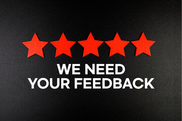 We Need Your Feedback text with five star on black background