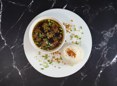 Flavorful Filipino Beef Pares Served with Rice and Soup