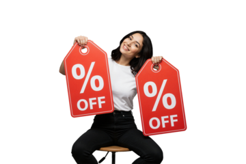 Smiling woman holding two large red discount tags with percent off signs