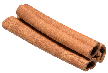 Stacked cinnamon sticks close-up, isolated background
