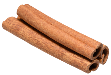 Stacked cinnamon sticks close-up, isolated background