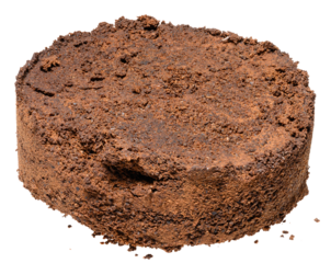 Pressed tablet of used ground coffee, coffee puck or cake
