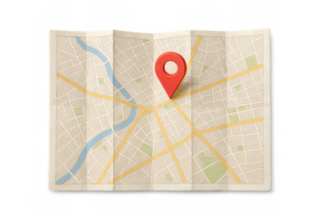 Folded map with red location pin marking a destination, showing navigation, travel planning, and route guidance