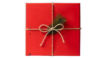 Red christmas gift box with twine and evergreen sprig isolated on transparent background